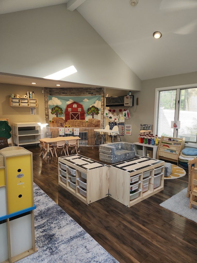 Children's classroom with small tables and storage units
