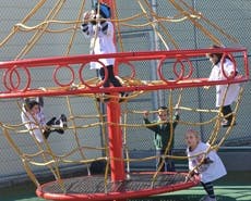 Children playing on a climbing structure