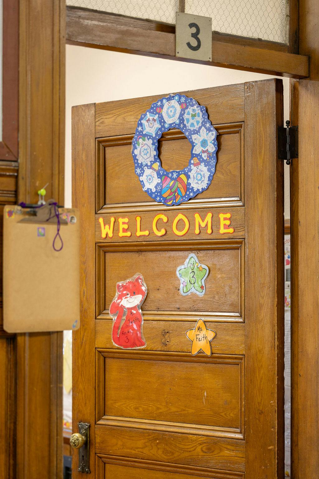 Classroom door with a "Welcome" sign and student art