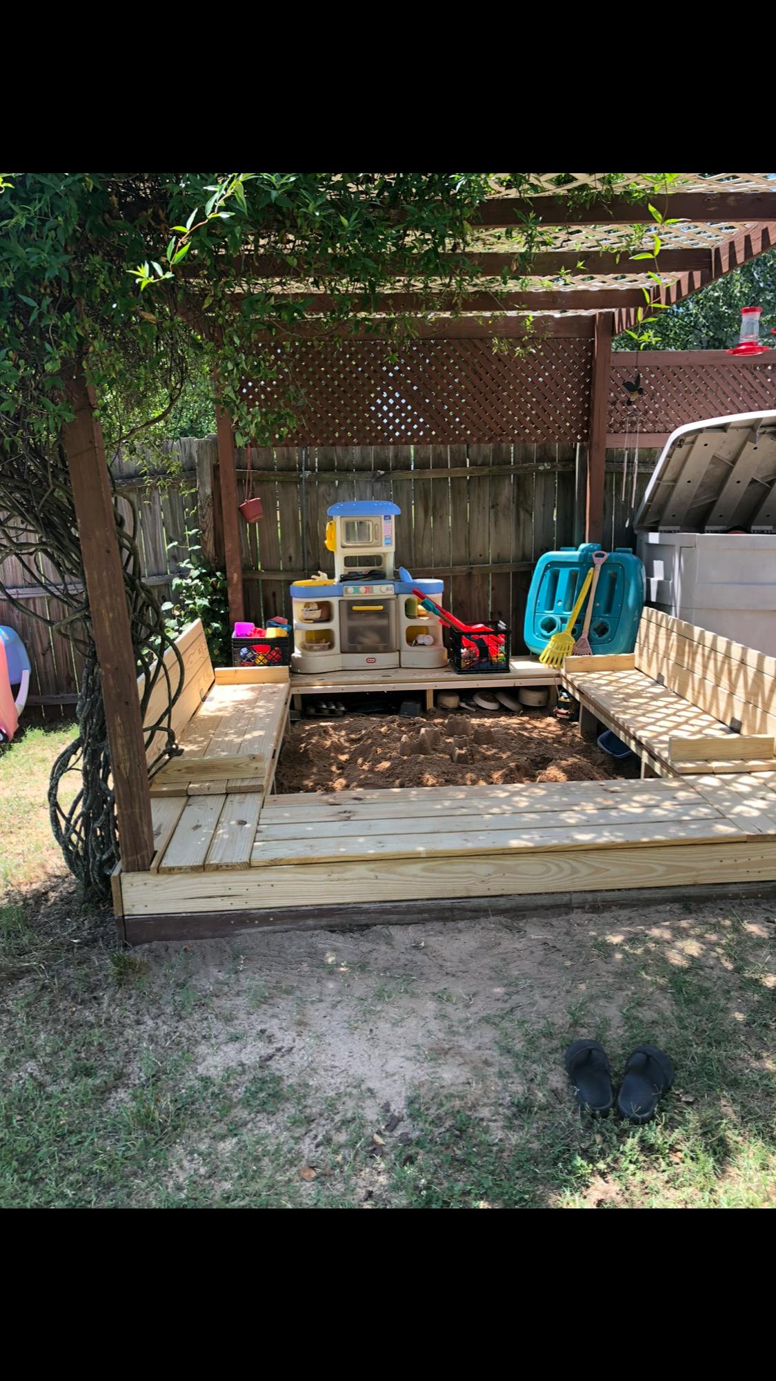Wooden sandbox with benches and play kitchen set