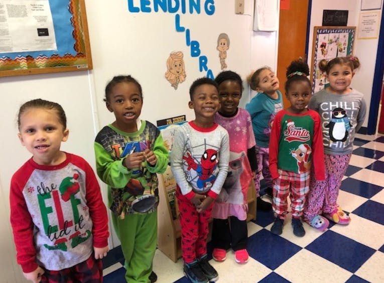 Group of children standing in pajamas