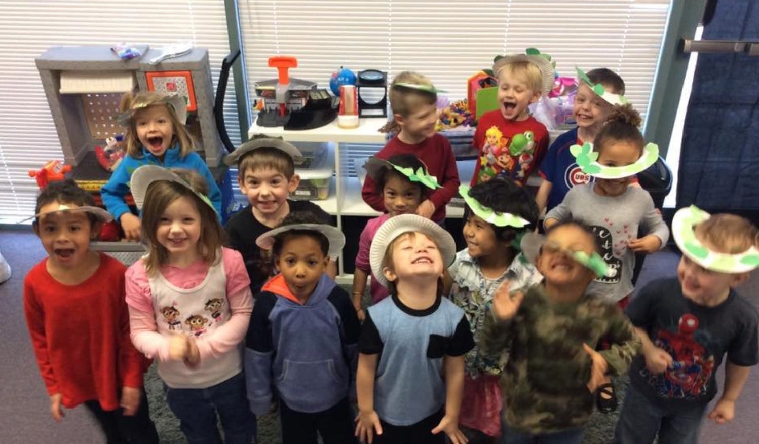 Group of children wearing hats in hats in hats and paper hats