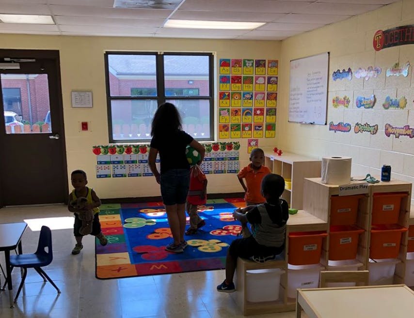 Adult and children in a classroom