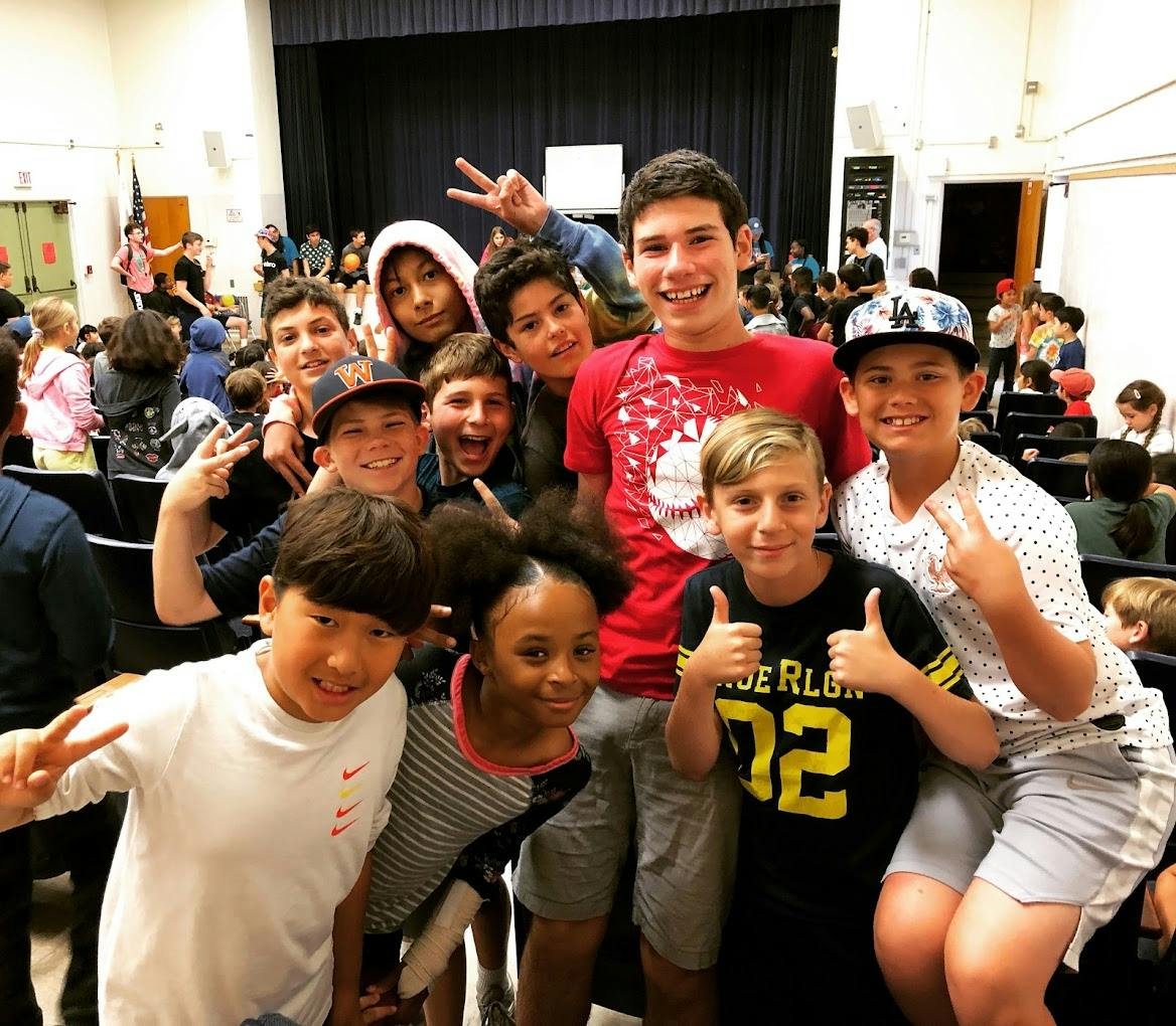 Group of children posing in an auditorium