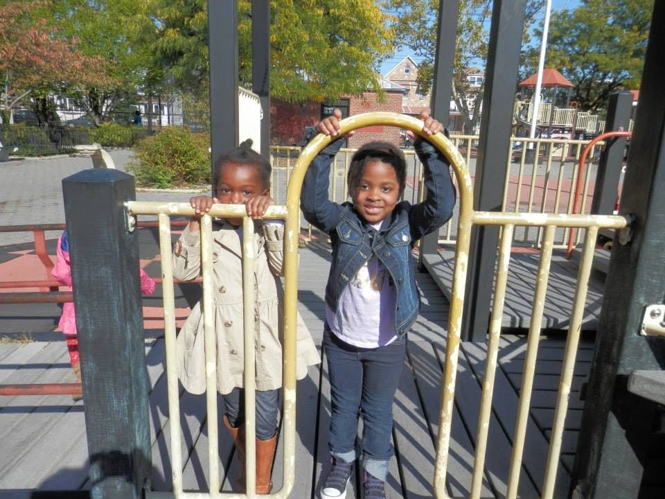 Two children on a playground structure