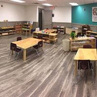 Classroom with tables and shelves