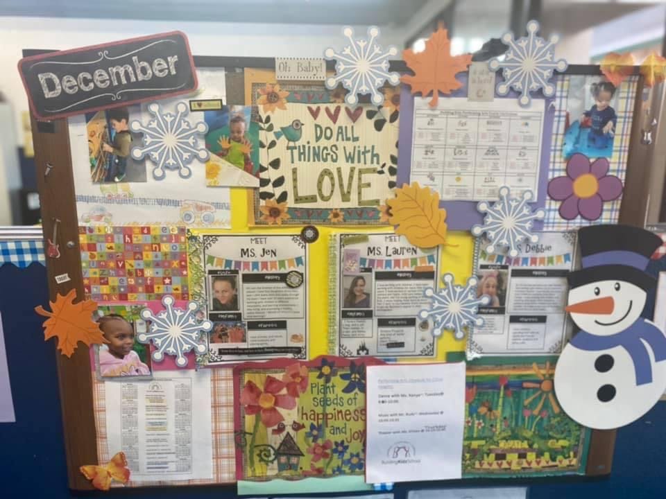 Bulletin board with "December" sign, calendar, and snowman decoration