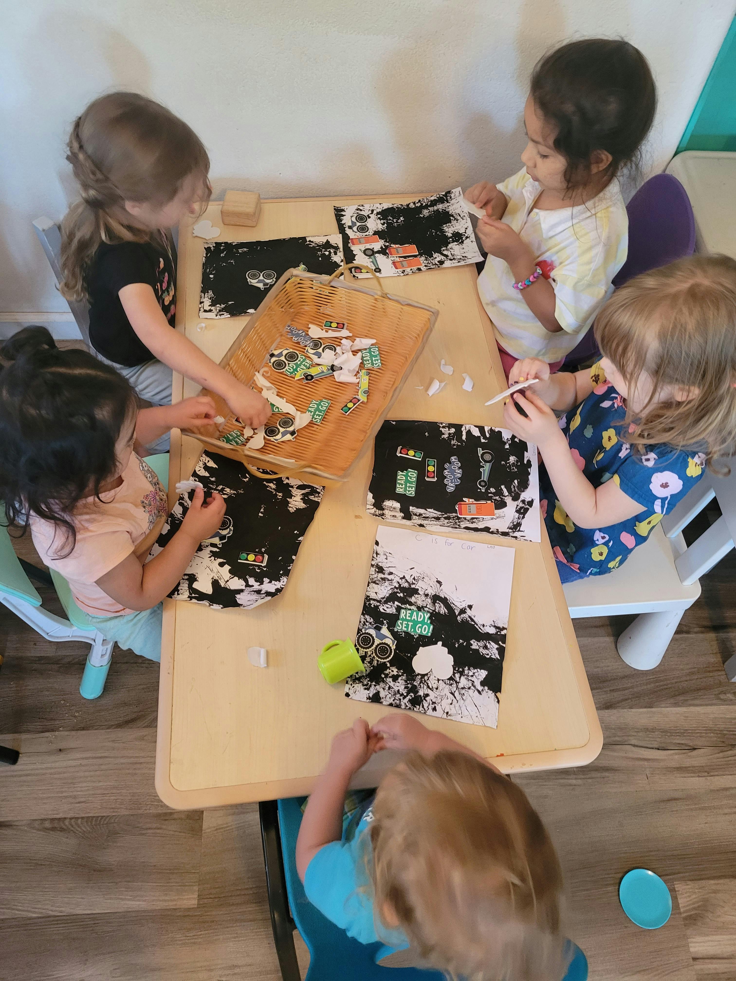 Children doing an art project at a table