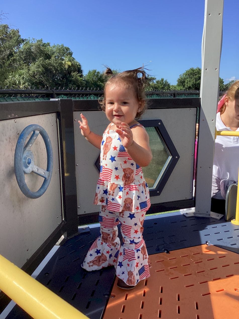 Child standing on a playground structure