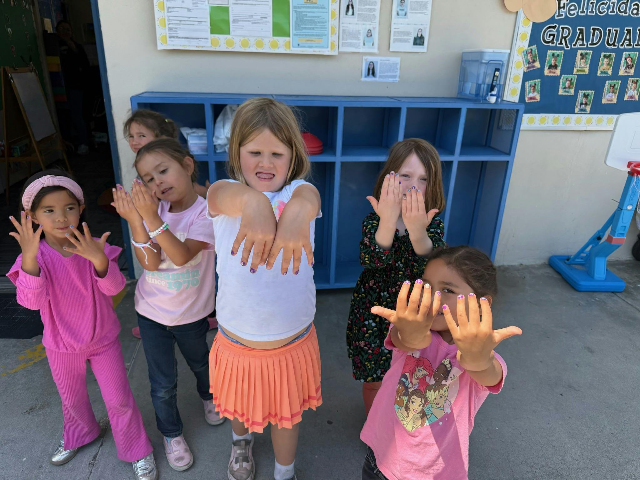 Children showing their hands to the camera