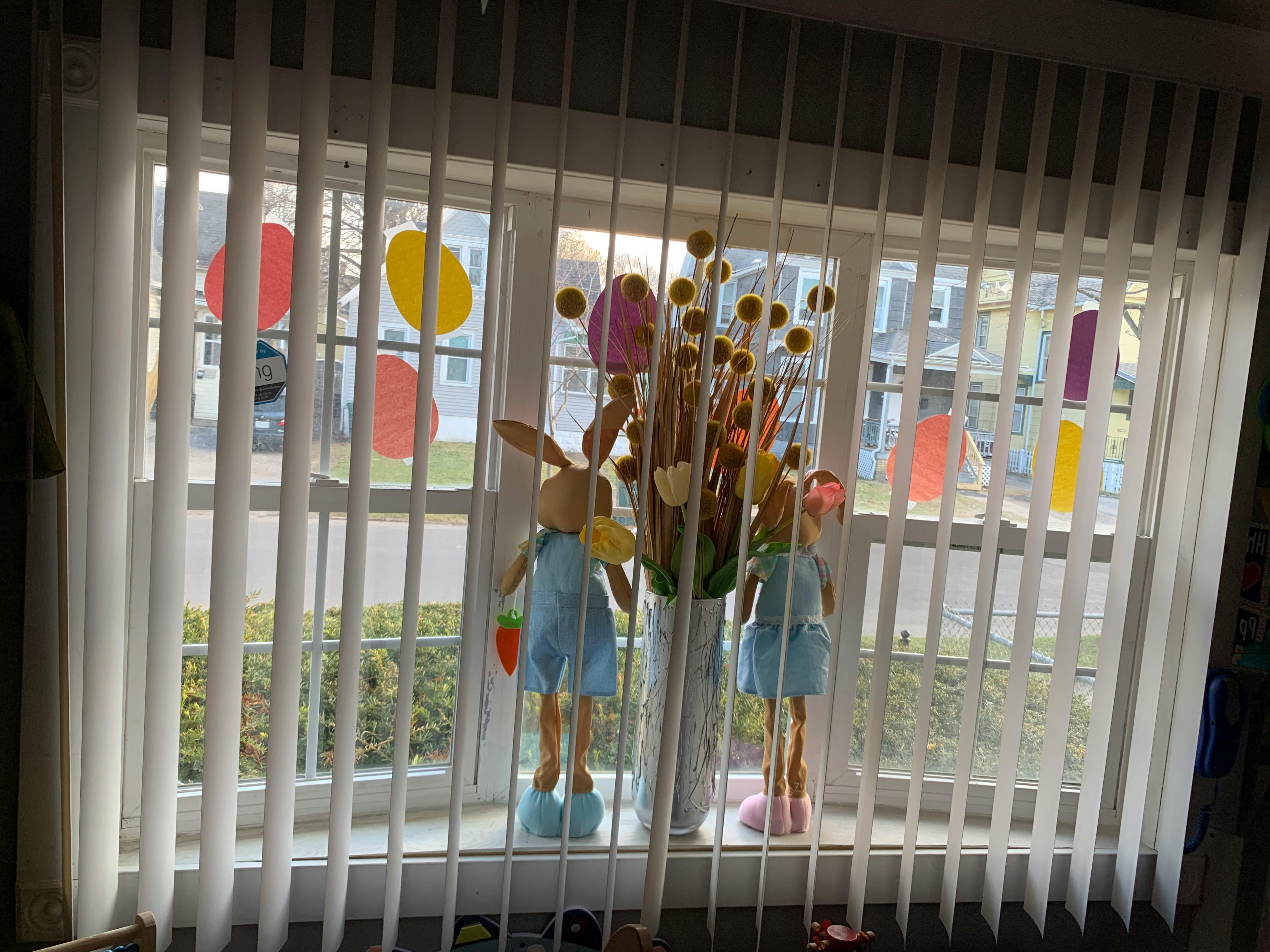 Window with vertical blinds and Easter decorations