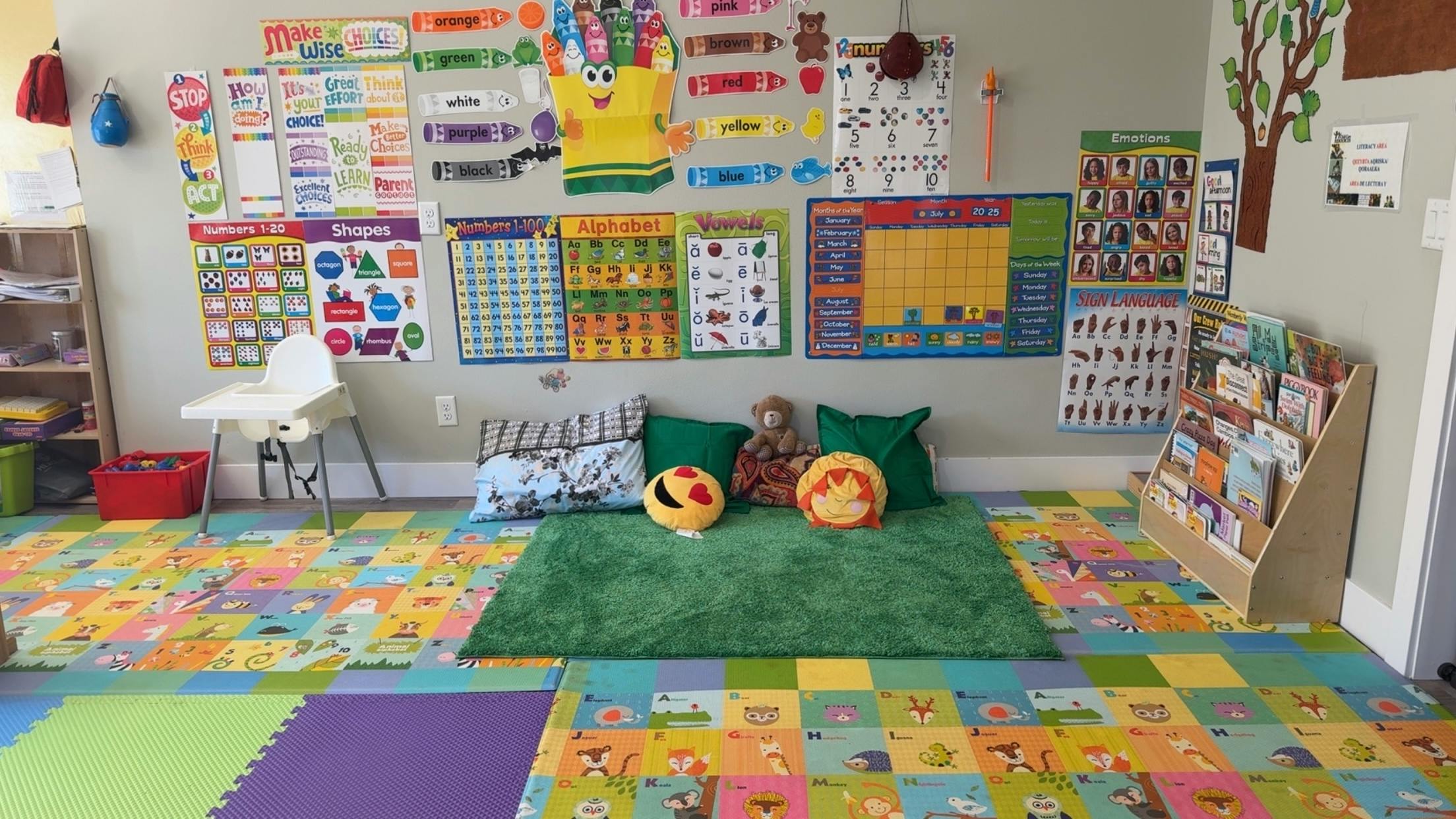 Child's play area with colorful floor mats and educational posters
