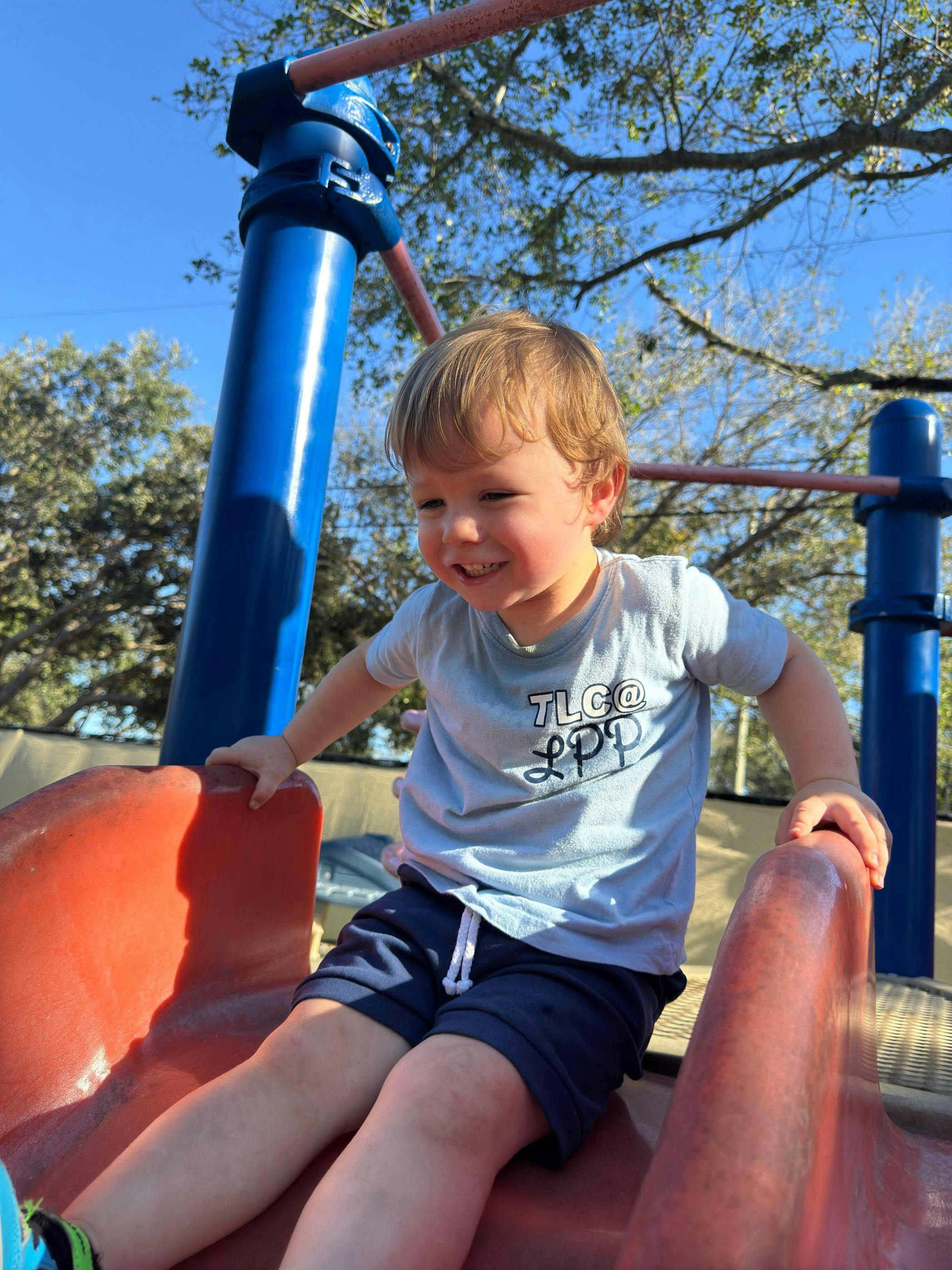 Child on a playground slide