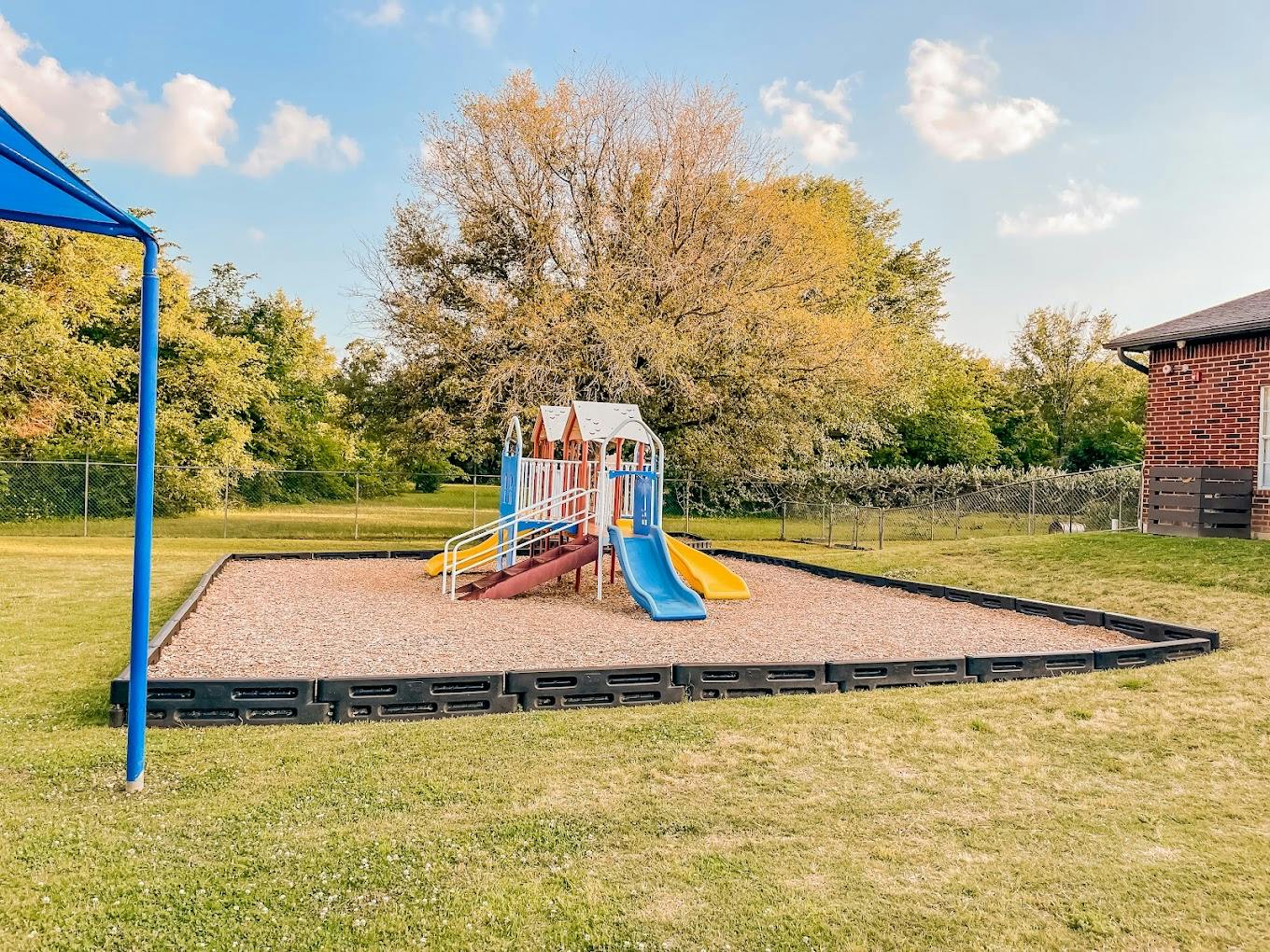 Playground structure with slides in an outdoor park setting