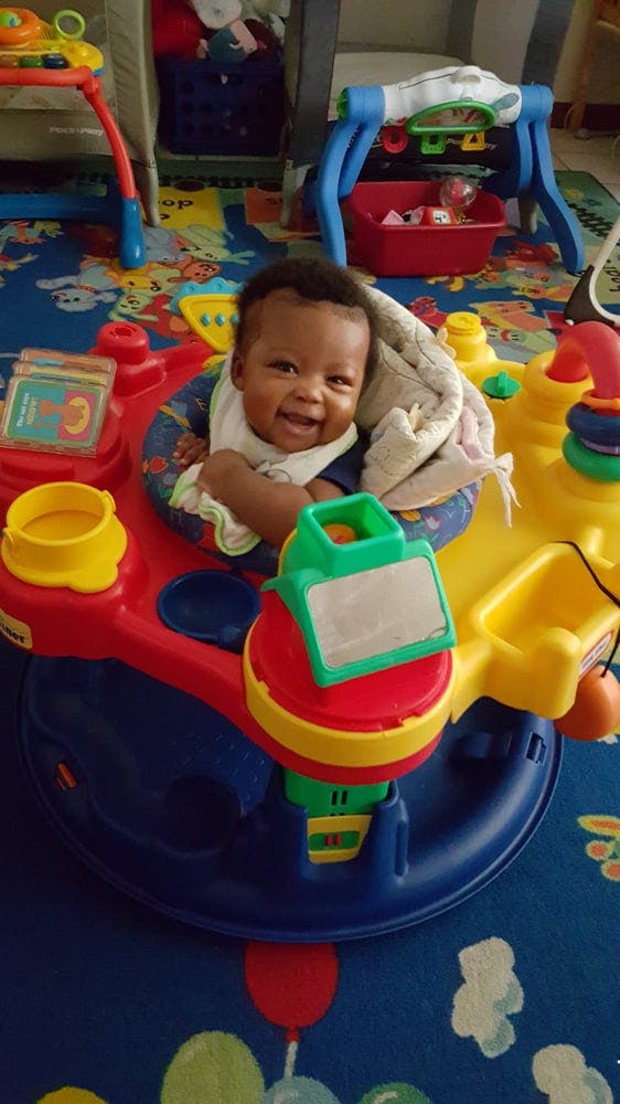 Child in a colorful activity center