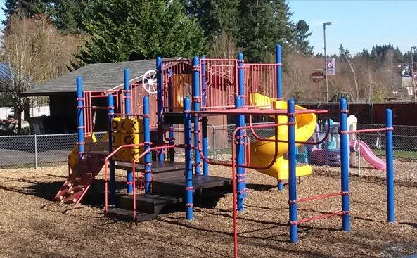 Playground structure with slides and climbing areas