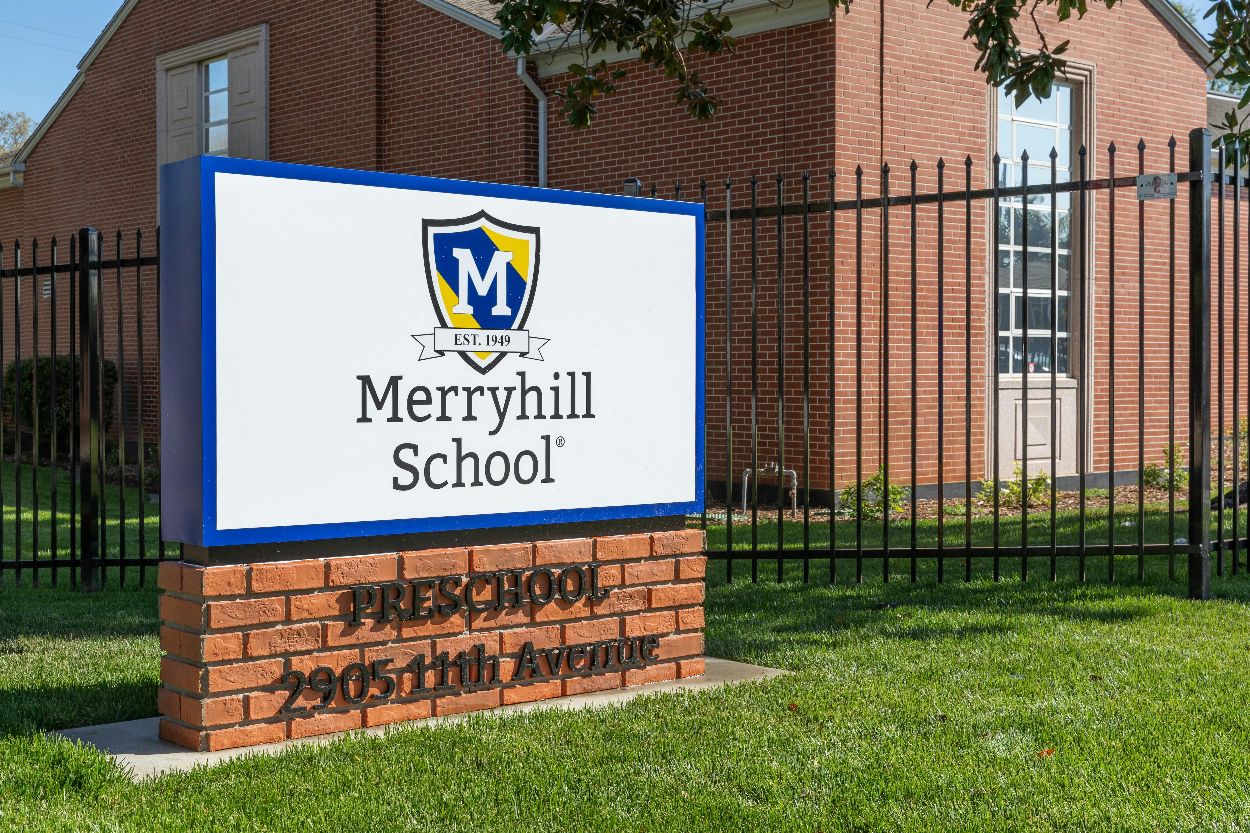 Merryhill School sign on a brick base