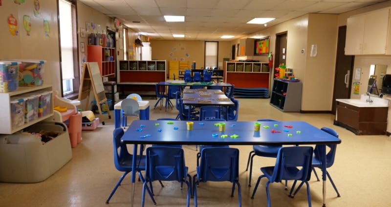 Classroom with blue tables and chairs