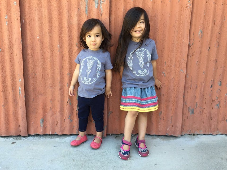 Two children standing side by side