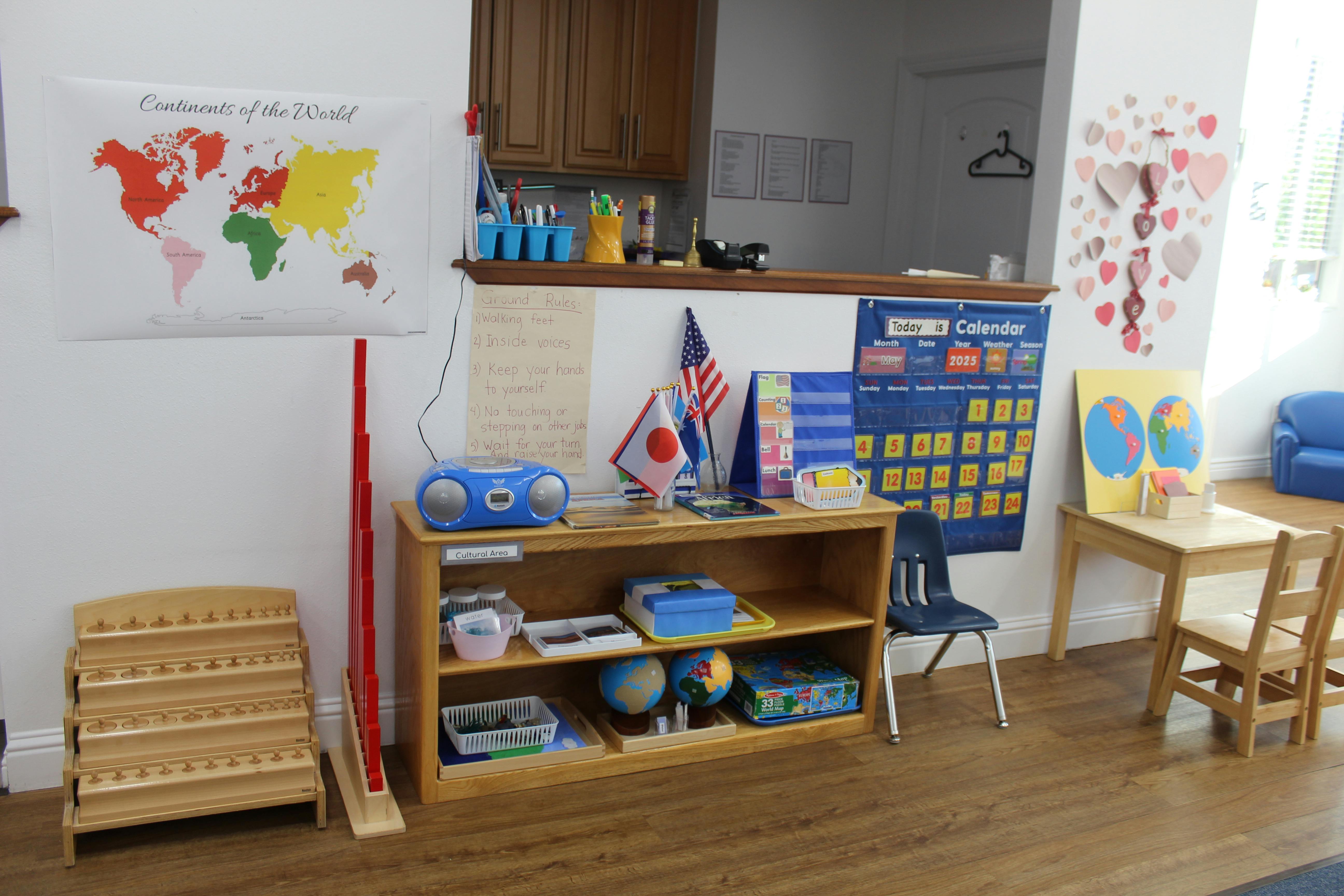 Classroom with world map, calendar, and learning materials