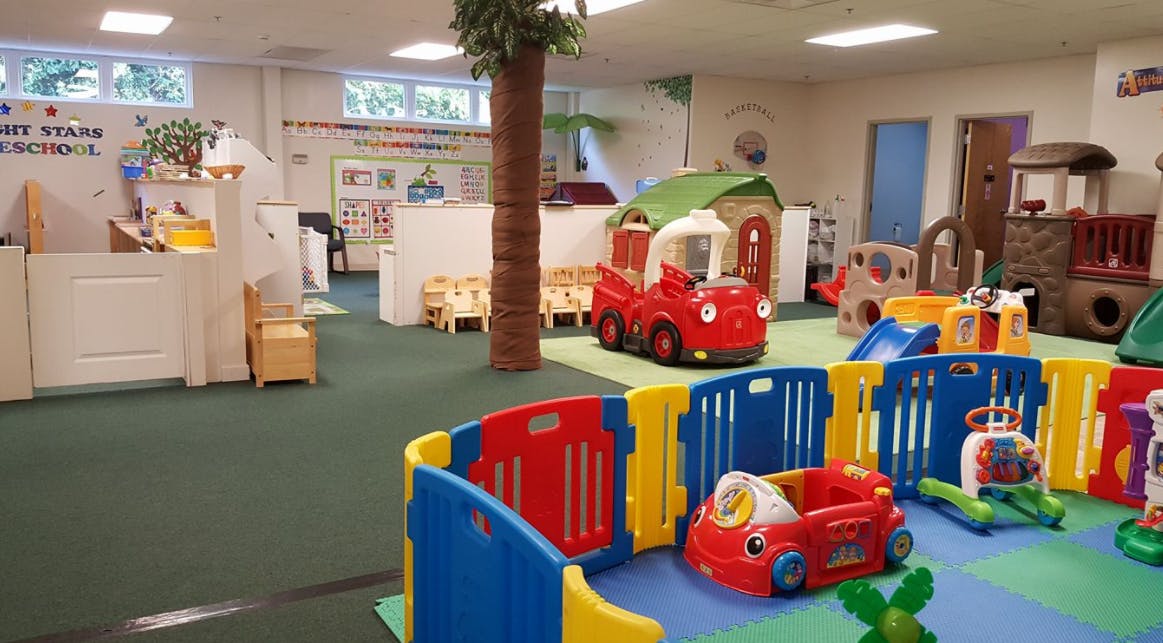 Indoor play area with various toys and play structures