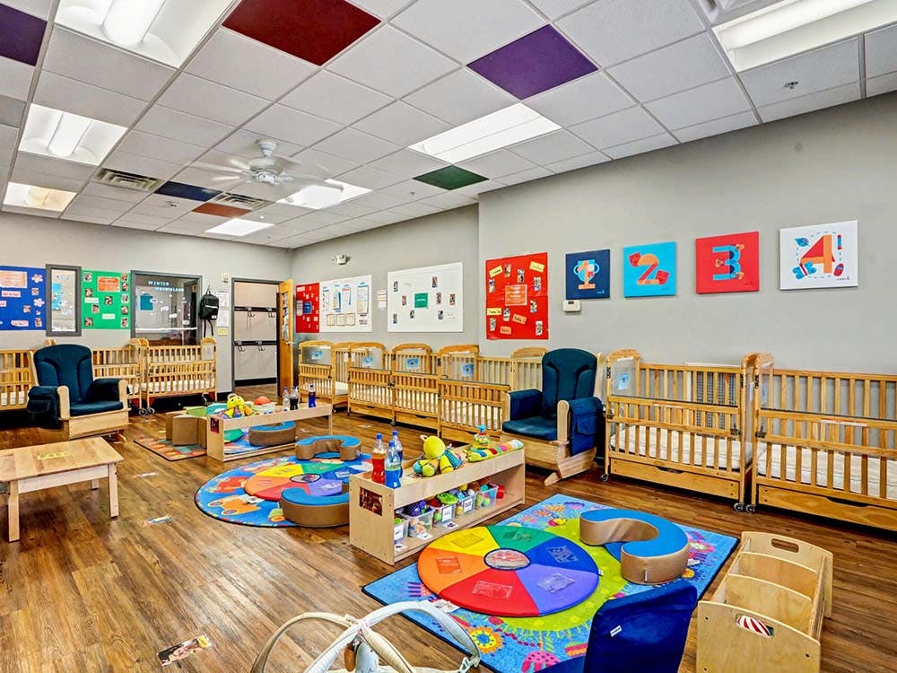 cribs in a daycare room