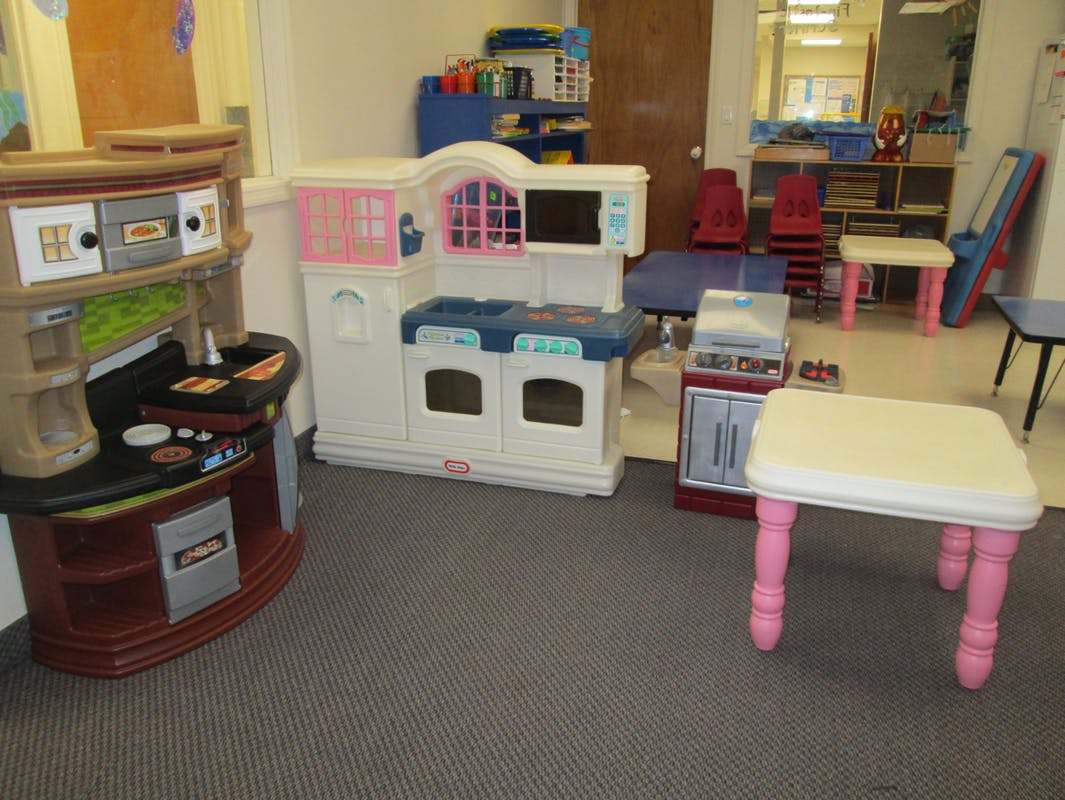 Play kitchen sets and small tables in a room