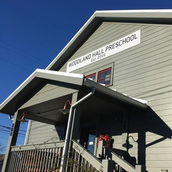 Woodland Hall Preschool sign on a building facade