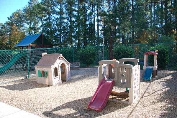 Playground with slides and playhouses