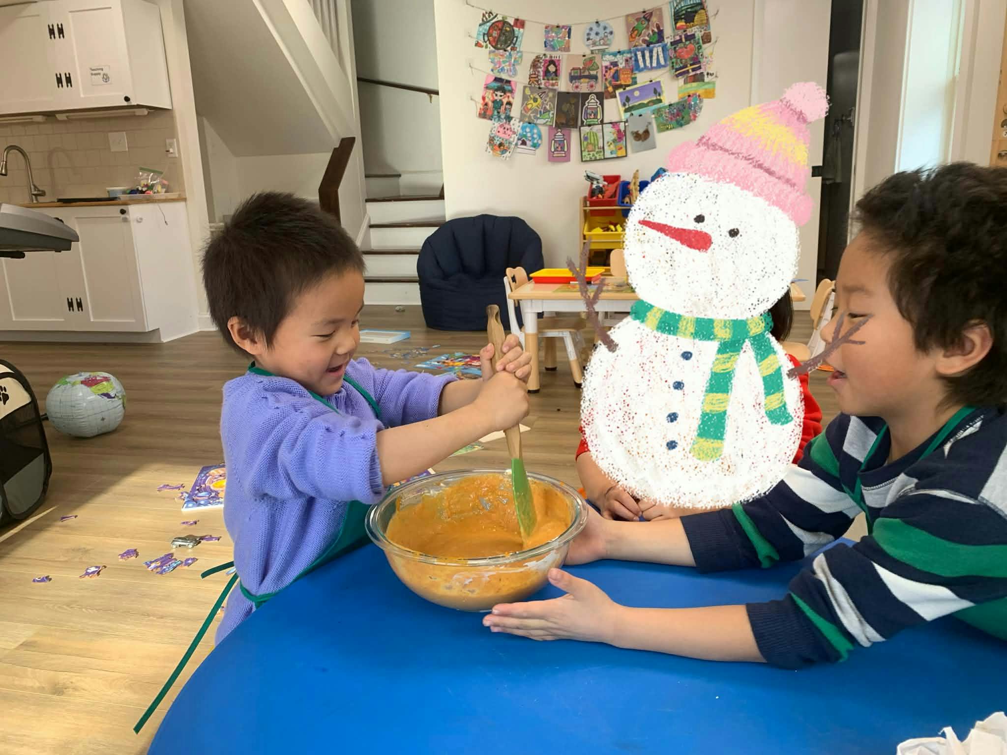 Two children mixing ingredients in a bowl