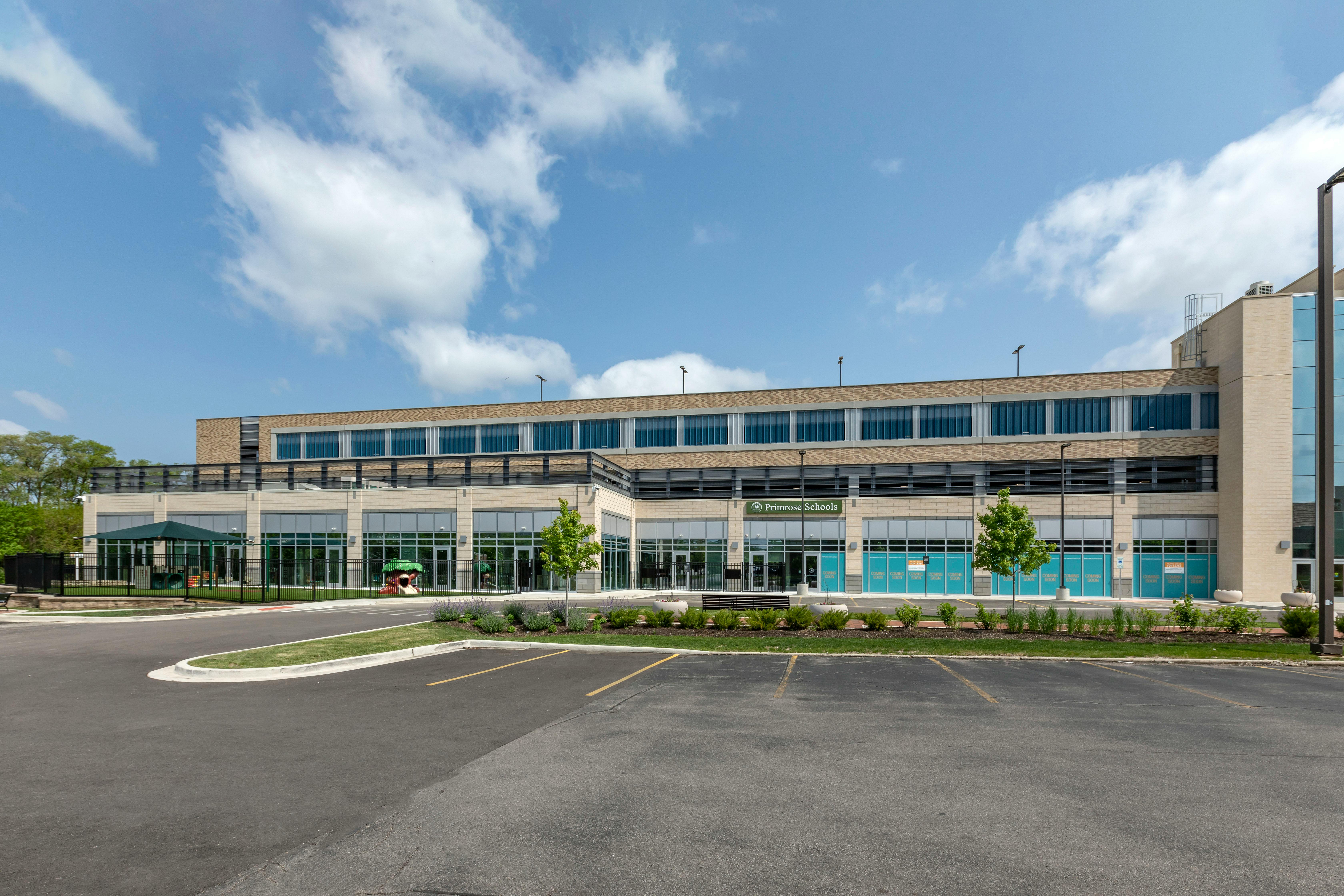 Exterior of Primrose Schools building with an empty parking lot in the foreground