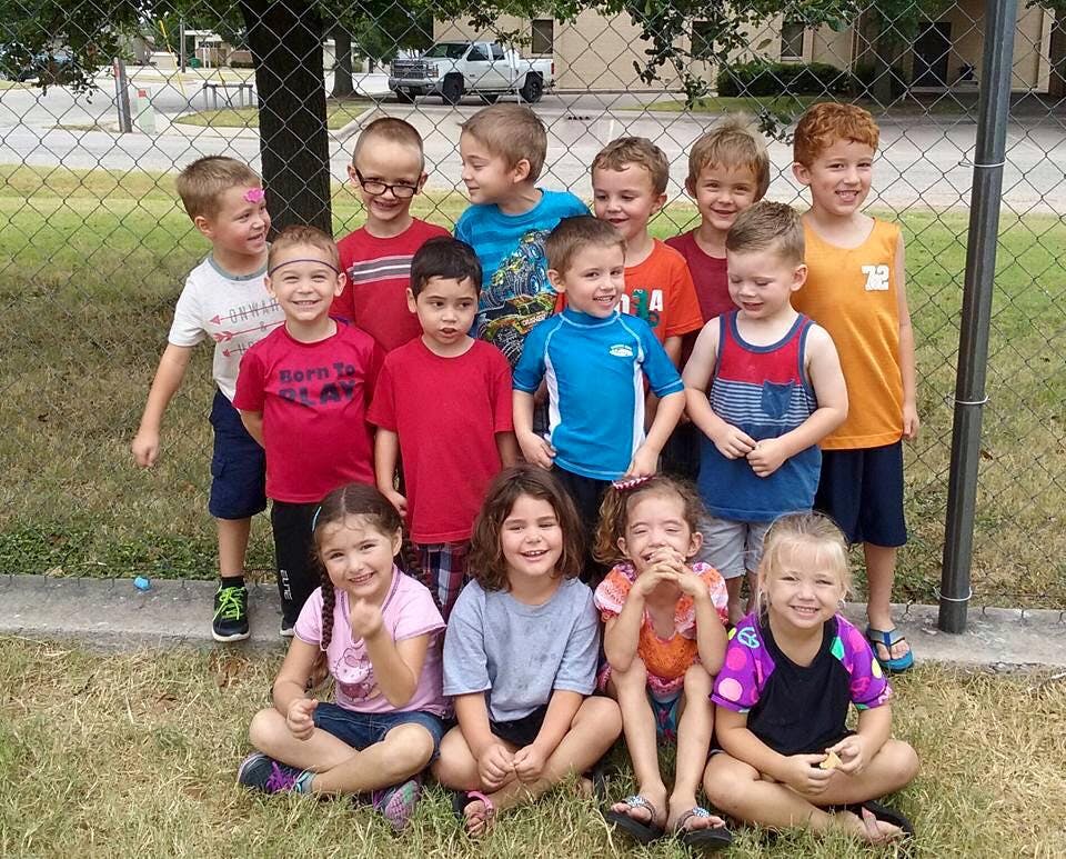 Group of children posing outdoors