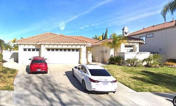House with two cars in the driveway
