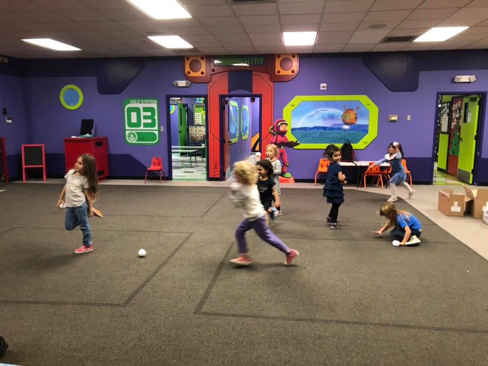 Children playing in an indoor activity area