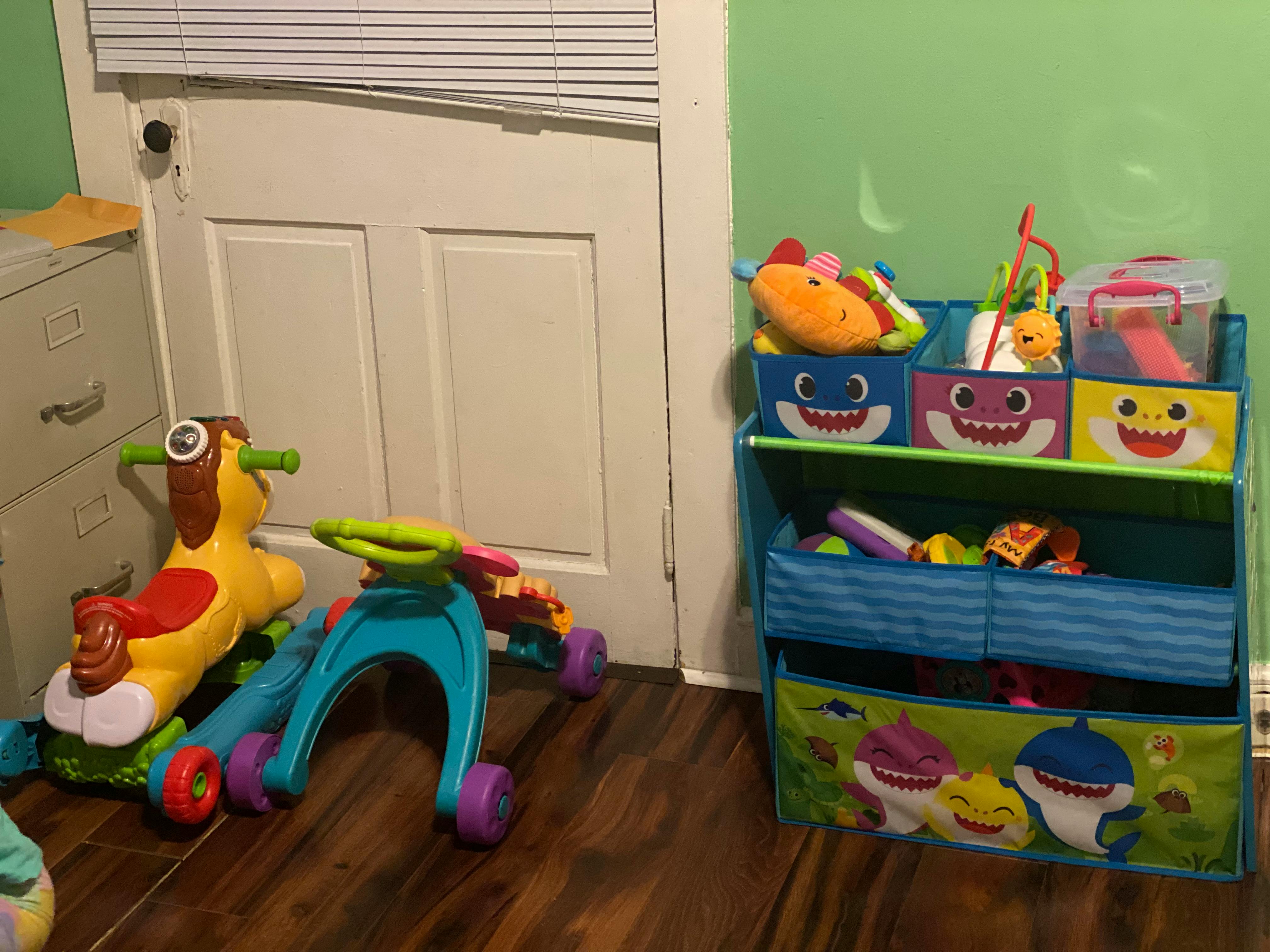 Child's toys and storage shelf with bins