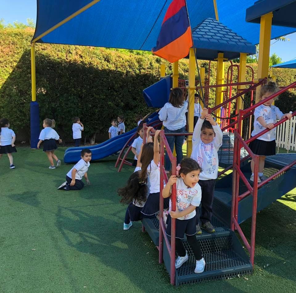 Children playing on a playground structure