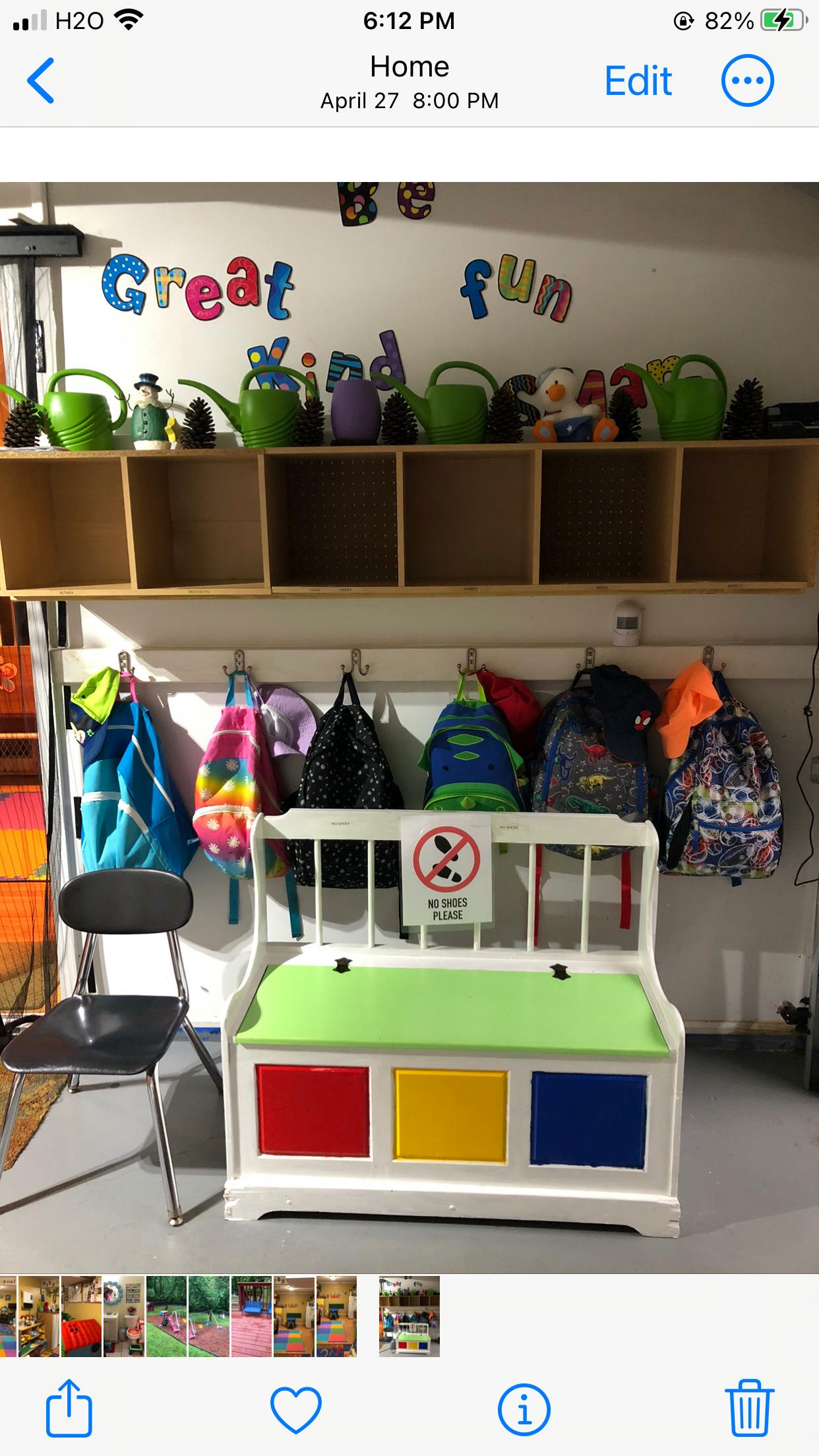 Children's cubbies with backpacks and a toy chest in a classroom