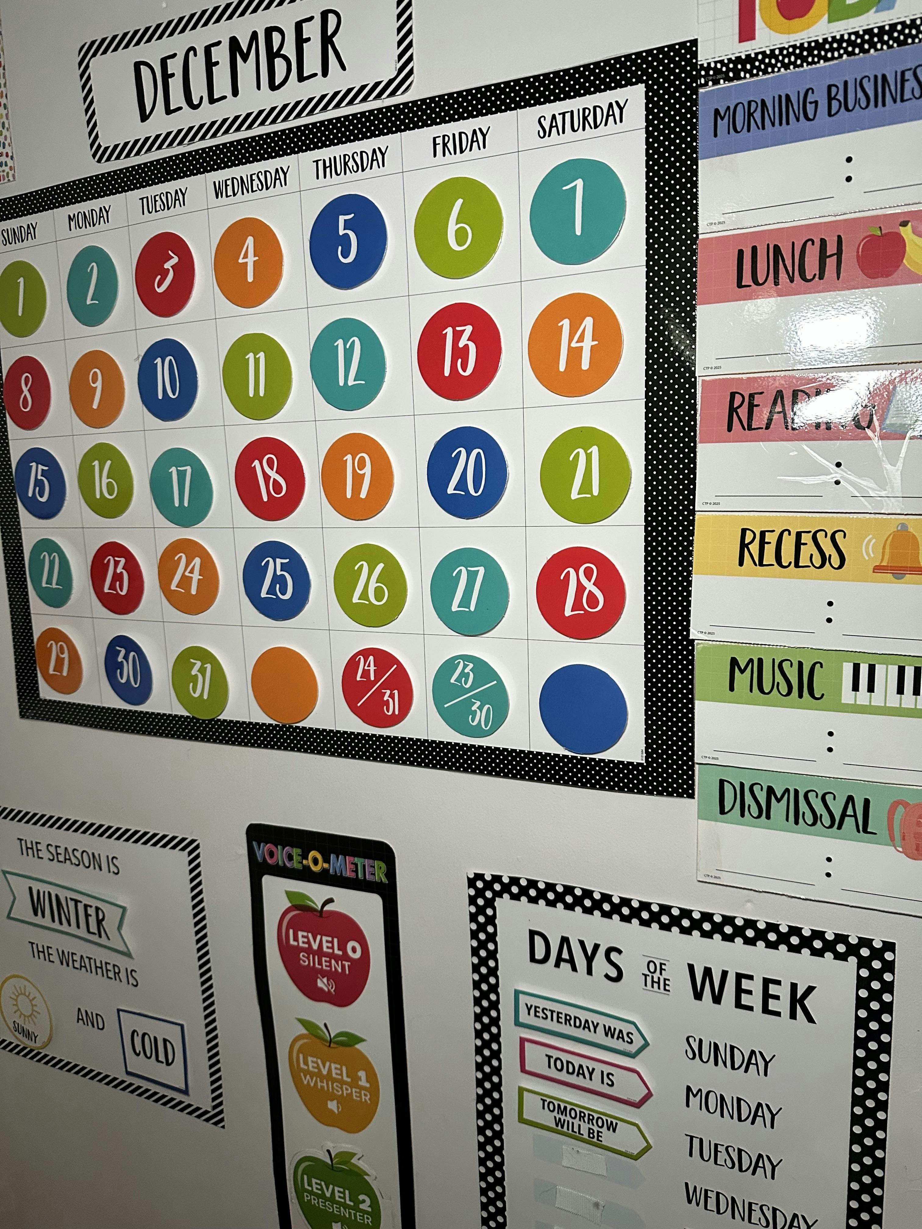 December classroom calendar and daily schedule charts on a wall