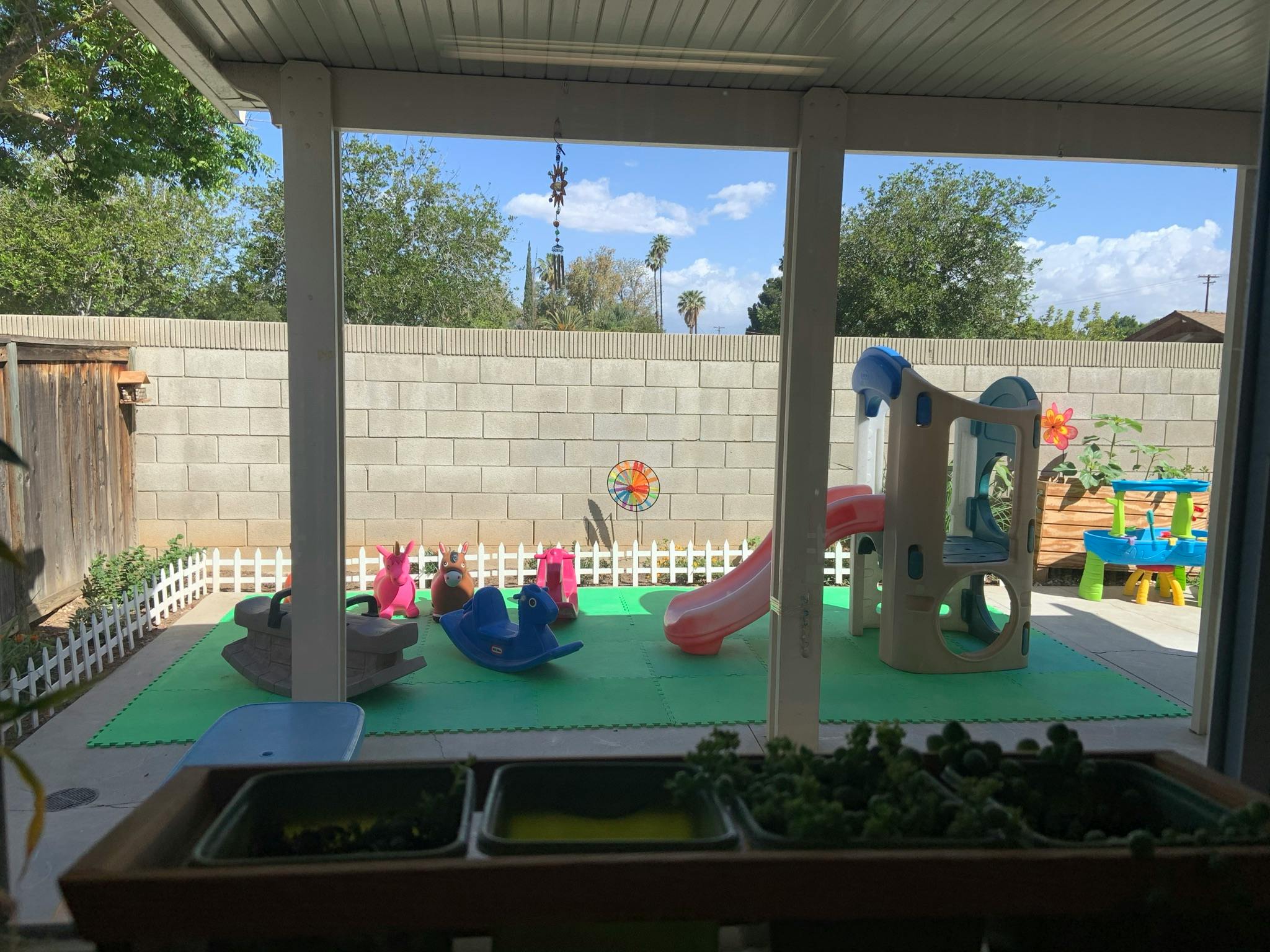 Outdoor playground with slides and rocking toys