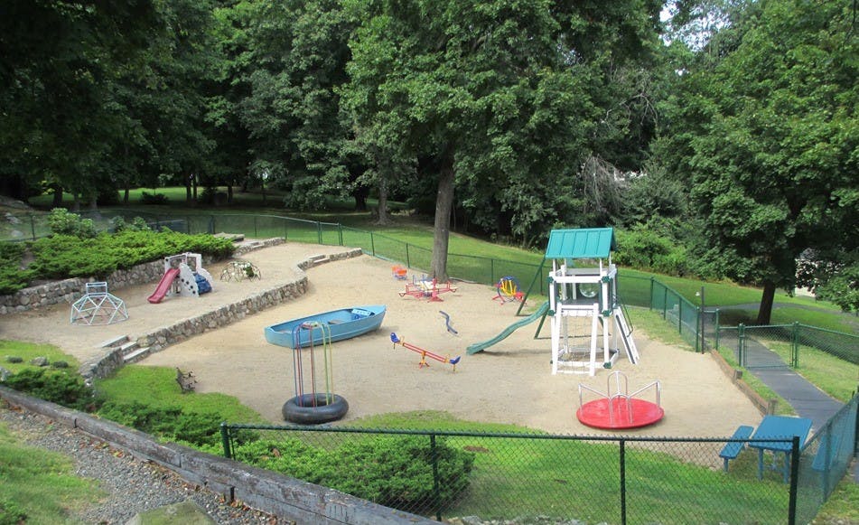 Playground with sand, slides, swings, and climbing structures