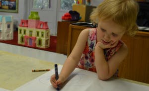 Child drawing with a crayon