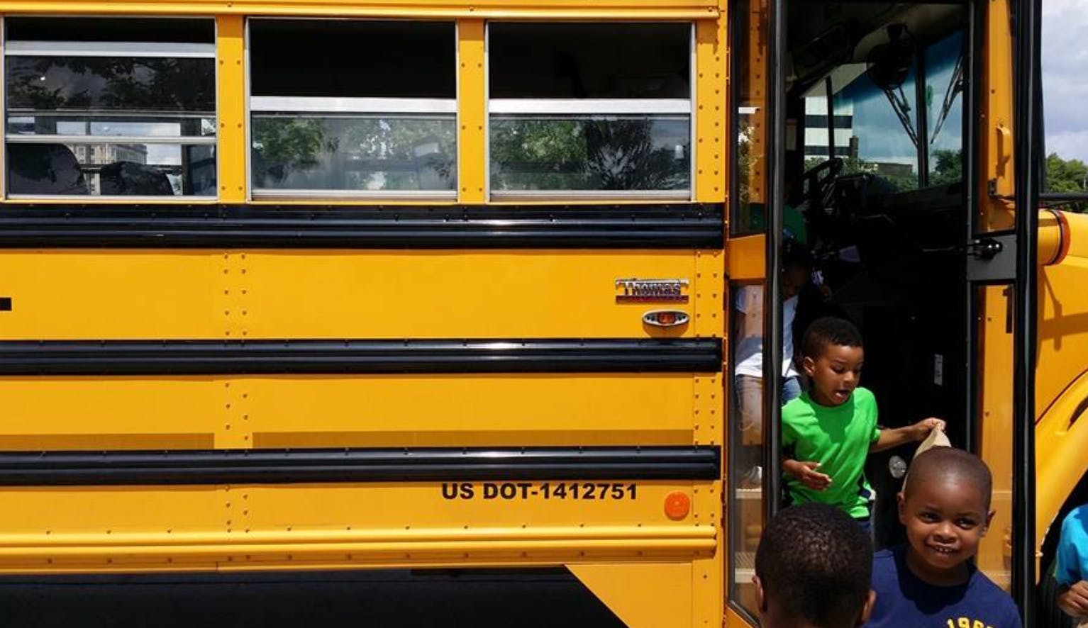 Children boarding a school bus