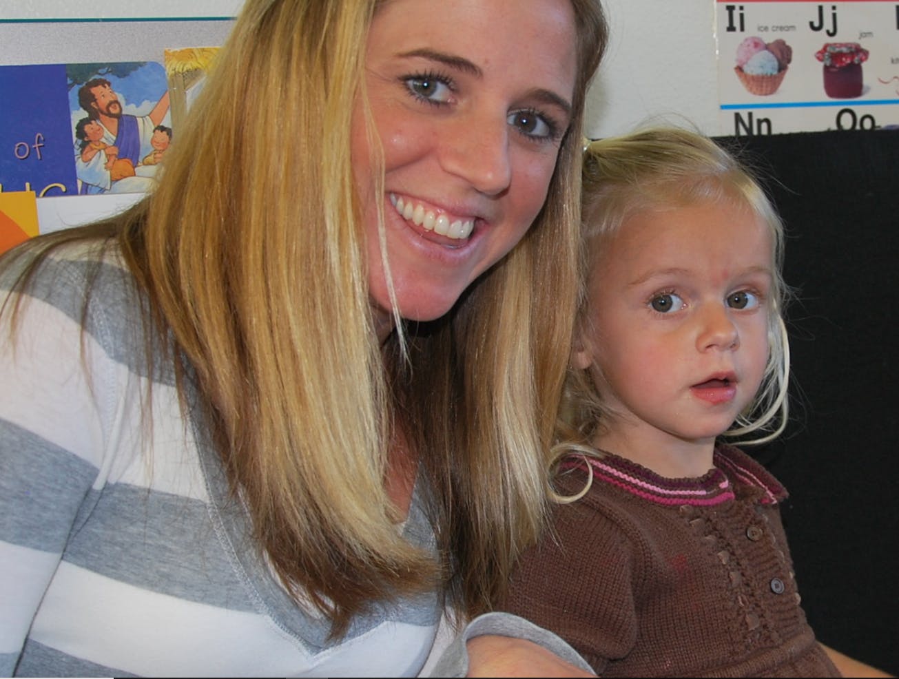 Person with long hair and a child