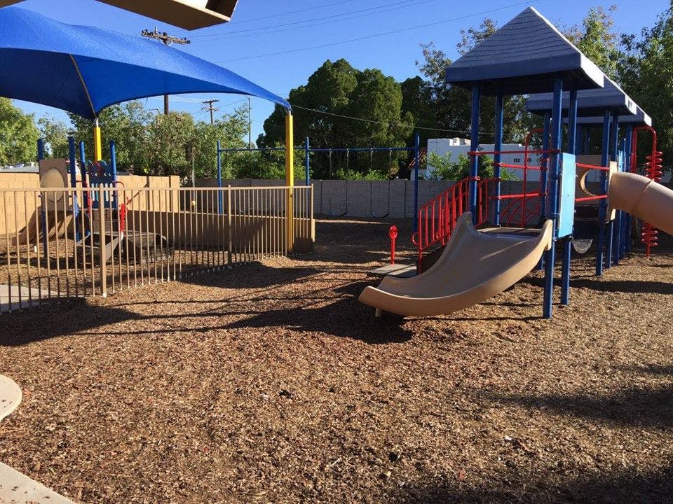 Playground with slides and shade structure