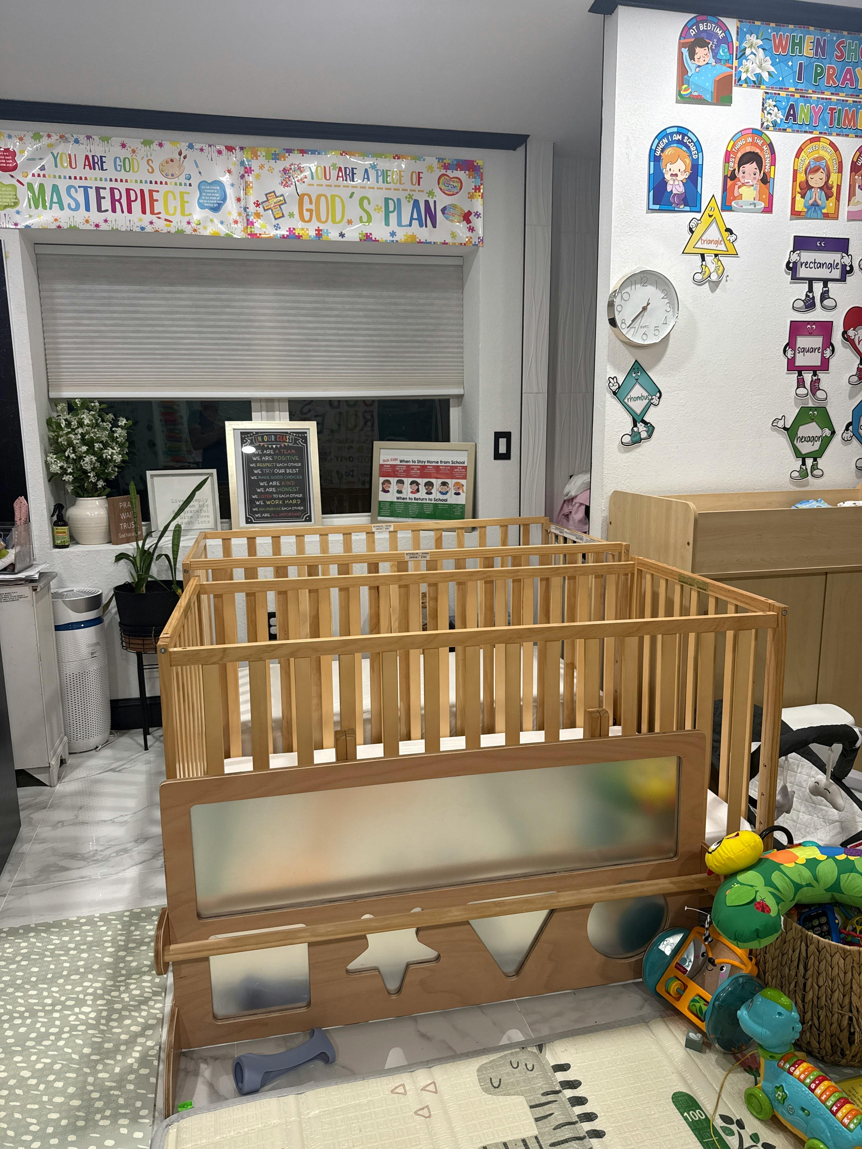 Wooden crib in a decorated classroom setting