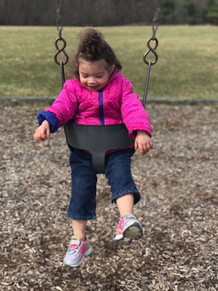 Child in a swing at a playground