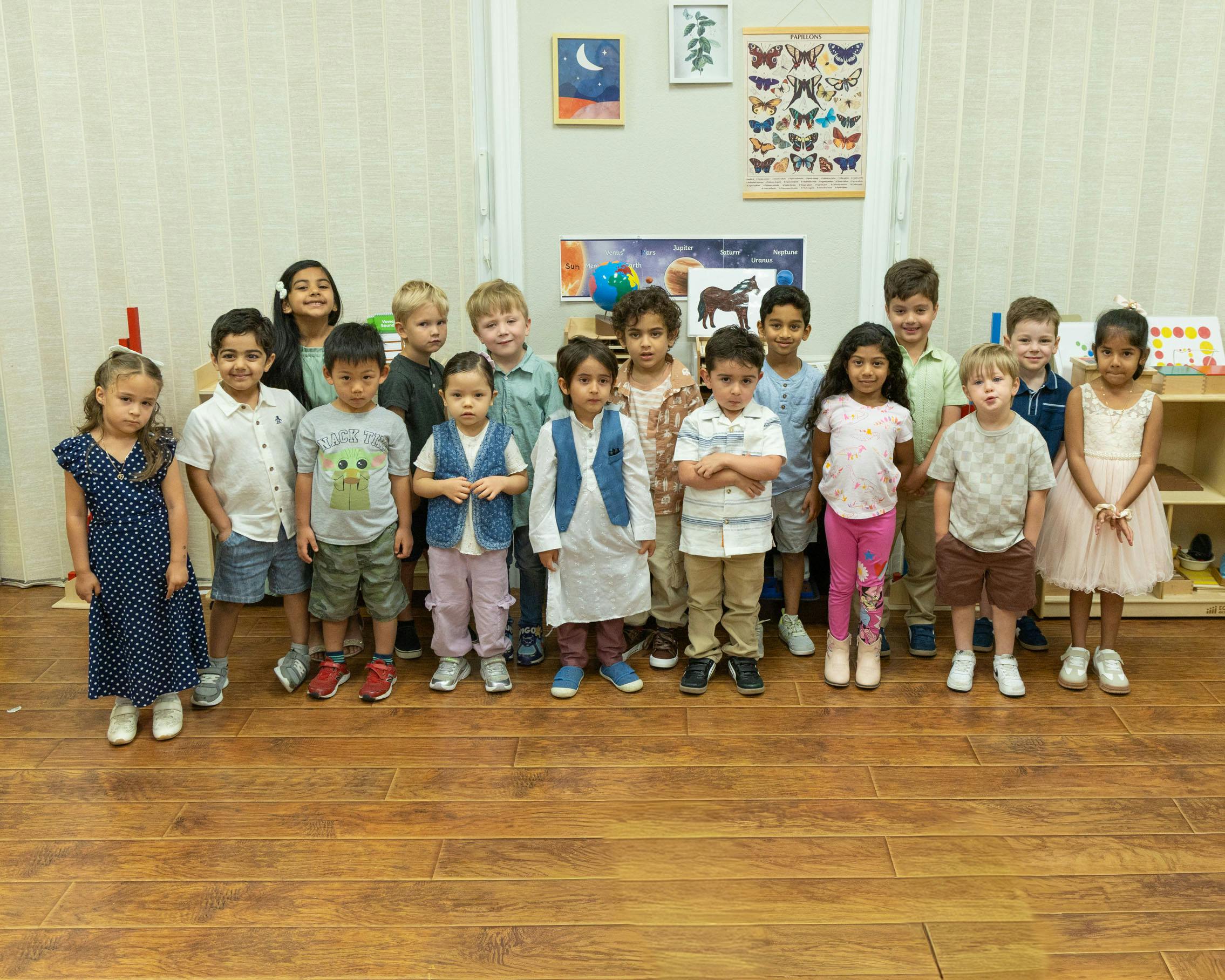Group of children standing in a classroom