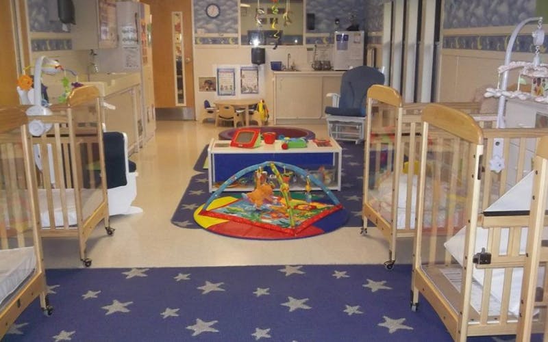 cribs in a daycare room