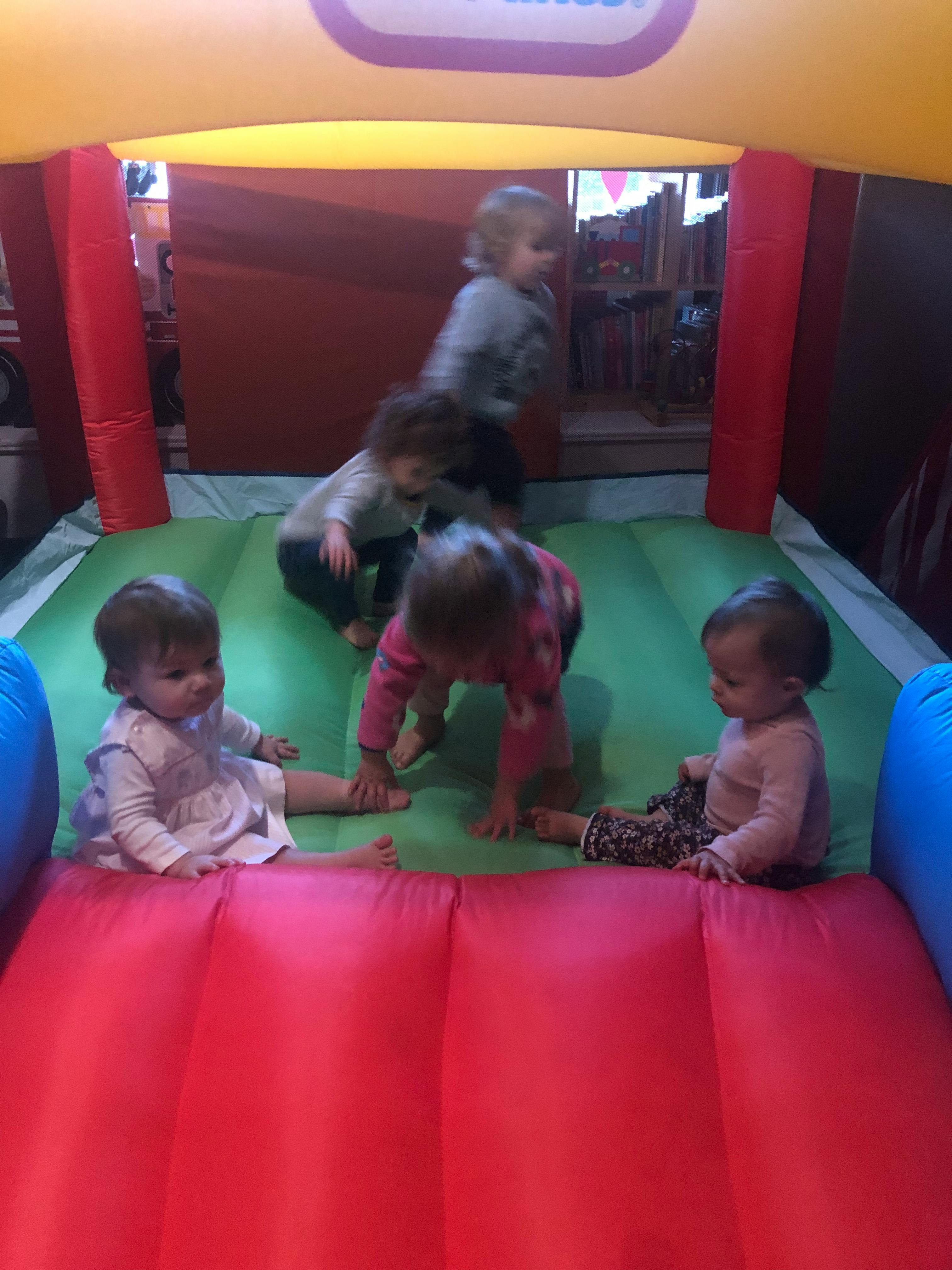 Children playing in an inflatable bounce house