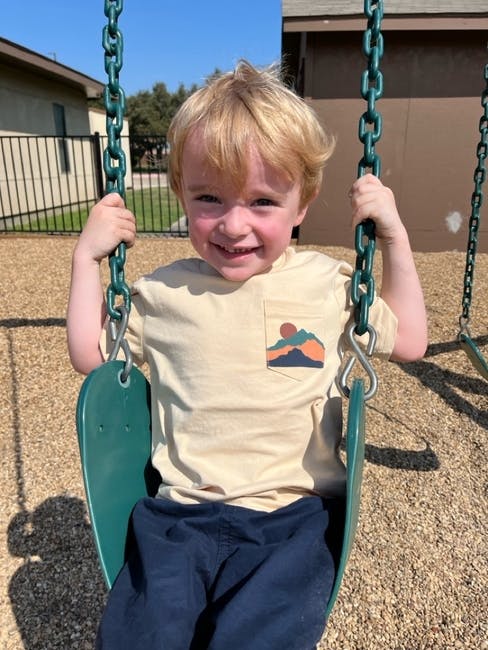 Child on a swing at a playground